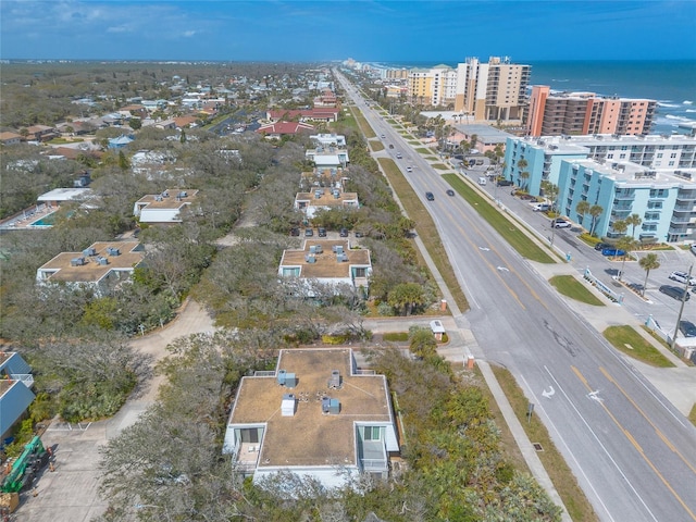 drone / aerial view featuring a view of city and a water view