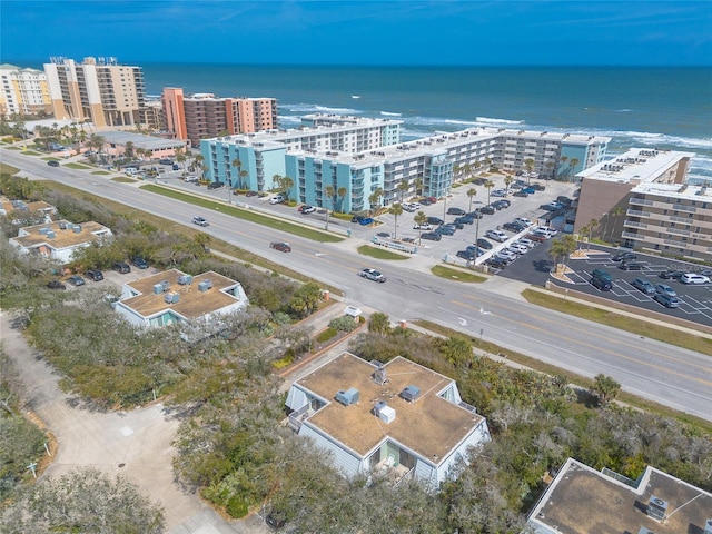 birds eye view of property featuring a view of city and a water view