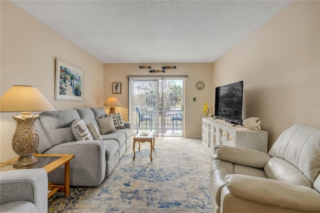 carpeted living room featuring a textured ceiling