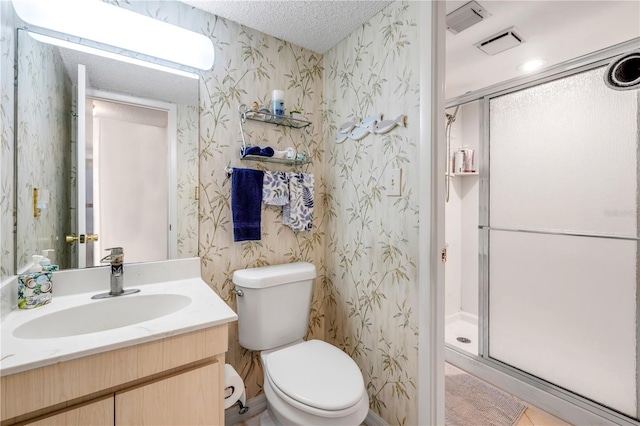 full bathroom with visible vents, toilet, a shower stall, a textured ceiling, and wallpapered walls