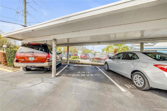 covered parking lot with fence