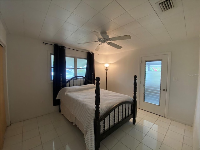 bedroom with visible vents, multiple windows, and light tile patterned floors
