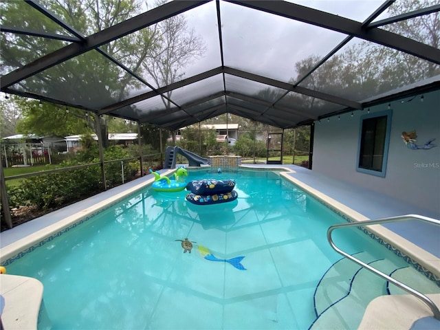 pool with a patio and a lanai