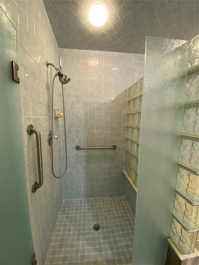 bathroom with tiled shower