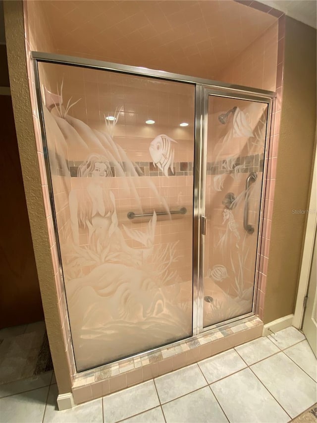 bathroom featuring a stall shower and tile patterned flooring