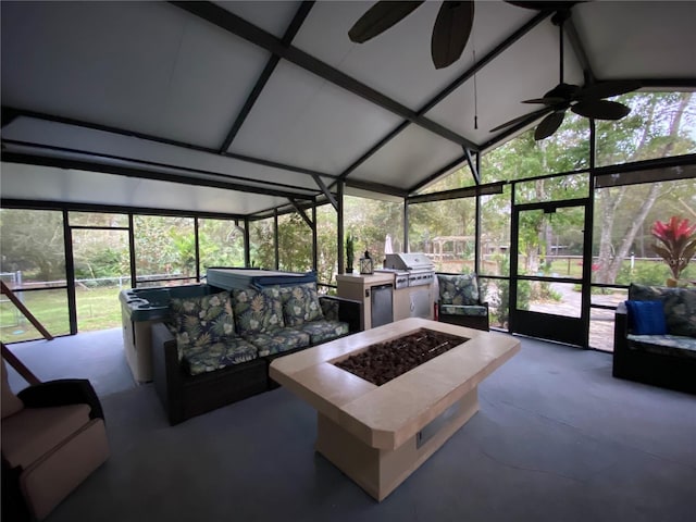 sunroom / solarium featuring lofted ceiling and a ceiling fan