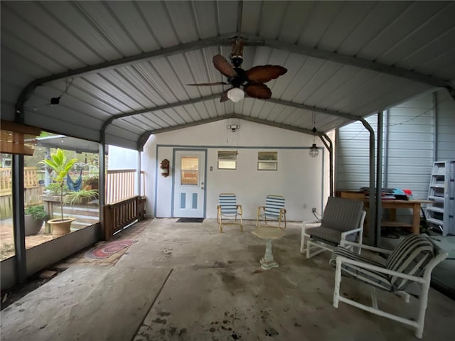 exterior space with ceiling fan and vaulted ceiling