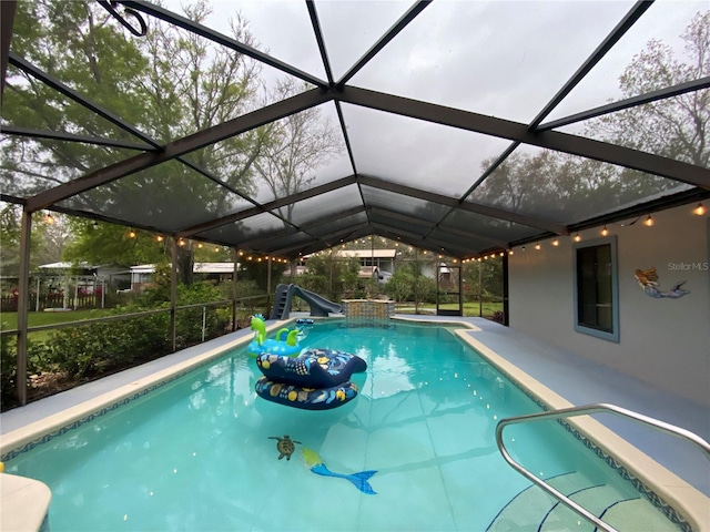 outdoor pool featuring a lanai and a patio