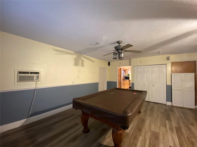 recreation room featuring ceiling fan, an AC wall unit, wood finished floors, and pool table