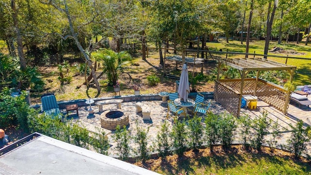 surrounding community with a patio area and an outdoor fire pit