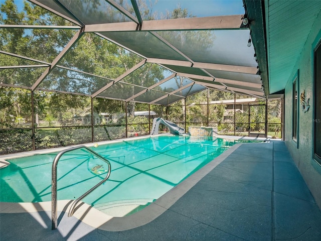 1370 Jane Lacey Ln, New Smyrna Beach, FL 32168 - swimming pool featuring a water slide, a patio, and glass enclosure