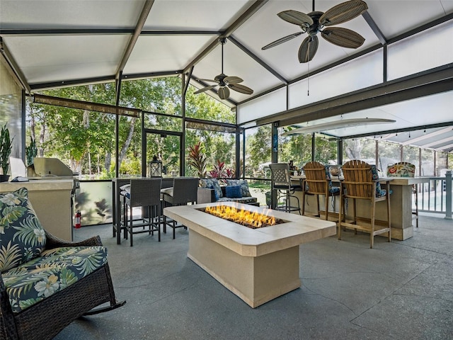 1370 Jane Lacey Ln, New Smyrna Beach, FL 32168 - view of patio featuring a fire pit, exterior bar, ceiling fan, and an outdoor kitchen