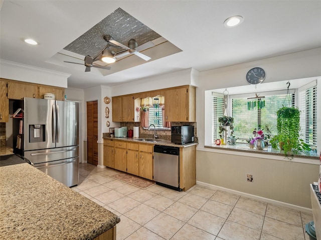1370 Jane Lacey Ln, New Smyrna Beach, FL 32168 - kitchen with appliances with stainless steel finishes, ceiling fan, a sink, light tile patterned flooring, and baseboards