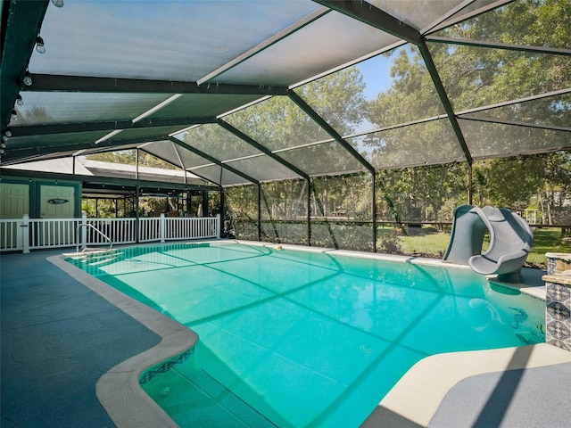 1370 Jane Lacey Ln, New Smyrna Beach, FL 32168 - outdoor pool with a water slide, a patio area, and glass enclosure