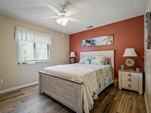 1370 Jane Lacey Ln, New Smyrna Beach, FL 32168 - bedroom featuring wood finished floors, a textured ceiling, baseboards, and a ceiling fan