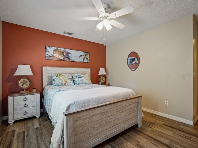 1370 Jane Lacey Ln, New Smyrna Beach, FL 32168 - bedroom featuring wood finished floors, baseboards, a ceiling fan, and a textured ceiling