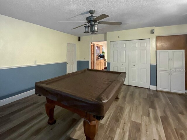 1370 Jane Lacey Ln, New Smyrna Beach, FL 32168 - recreation room featuring billiards, a ceiling fan, dark wood-style floors, a textured ceiling, and baseboards