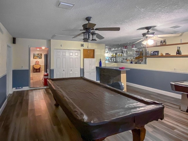 1370 Jane Lacey Ln, New Smyrna Beach, FL 32168 - rec room with billiards table, a ceiling fan, wood finished floors, baseboards, and a textured ceiling