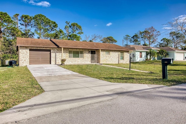 single story home featuring an attached garage, stone siding, driveway, and a front lawn