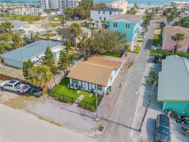 birds eye view of property featuring a residential view and a water view