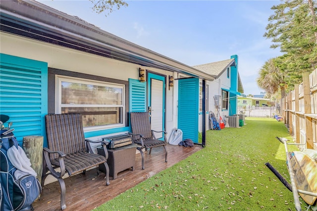 view of yard with cooling unit and fence