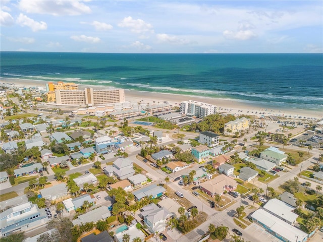 aerial view featuring a water view and a beach view