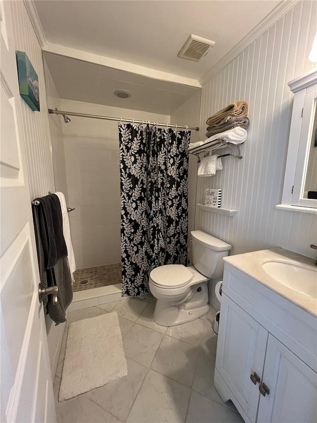 bathroom with visible vents, toilet, marble finish floor, a tile shower, and vanity