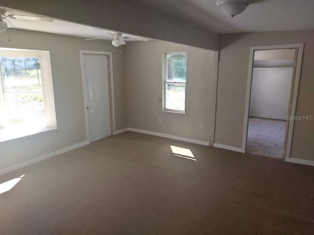 unfurnished bedroom featuring carpet floors and baseboards