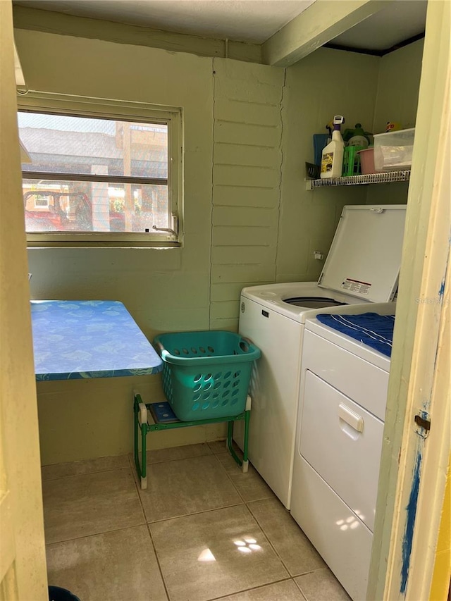 630 Yupon Ave, New Smyrna Beach, FL 32169 - clothes washing area with laundry area, light tile patterned floors, and separate washer and dryer