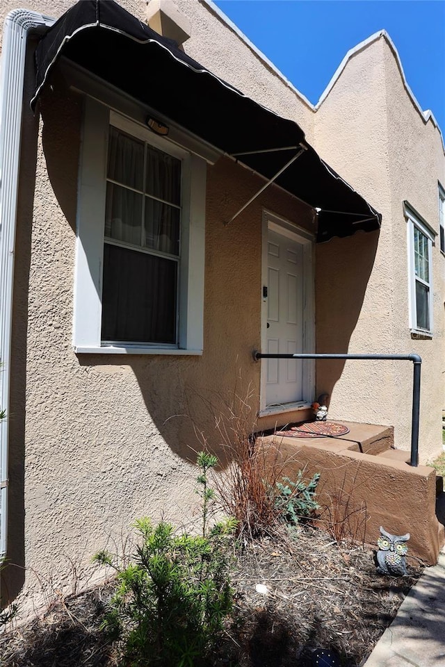 exterior space featuring stucco siding