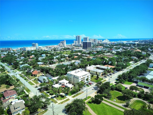 birds eye view of property featuring a view of city and a water view