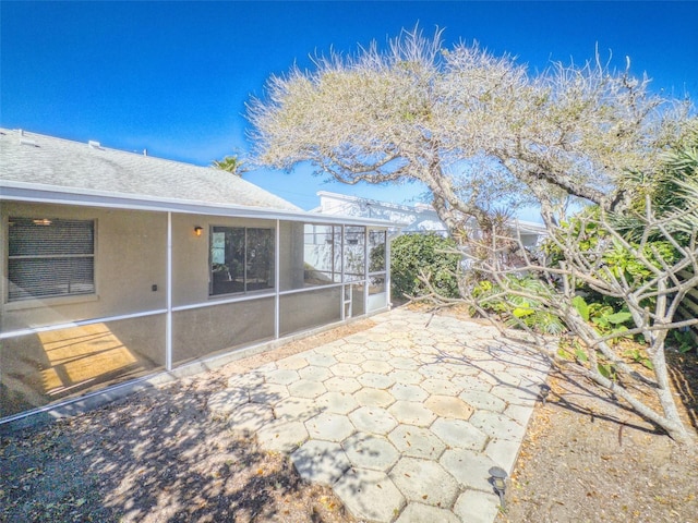 3827 Schoolway Ave, New Smyrna Beach, FL 32169 - view of patio / terrace with a sunroom