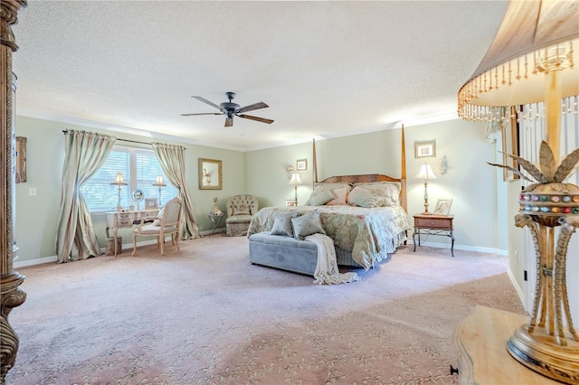 bedroom with carpet floors, baseboards, ornamental molding, and a textured ceiling