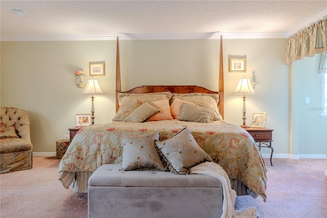 carpeted bedroom featuring a textured ceiling, ornamental molding, and baseboards