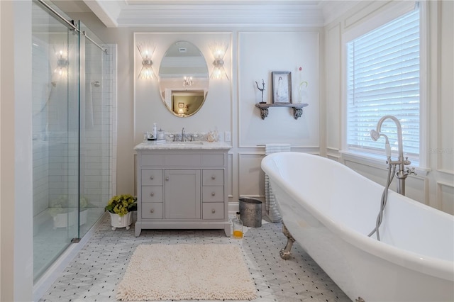 bathroom with a stall shower, a decorative wall, a freestanding bath, and vanity