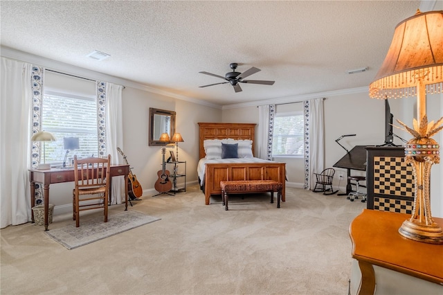 bedroom with carpet flooring, crown molding, visible vents, and a textured ceiling