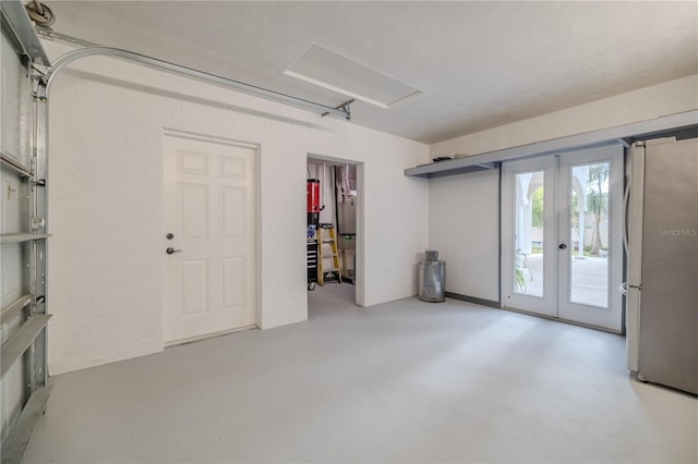 garage with french doors and freestanding refrigerator