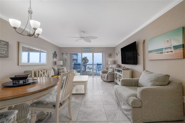 111 N Atlantic Ave Unit A219, New Smyrna Beach, FL 32169 - dining space with a wealth of natural light, crown molding, and ceiling fan with notable chandelier