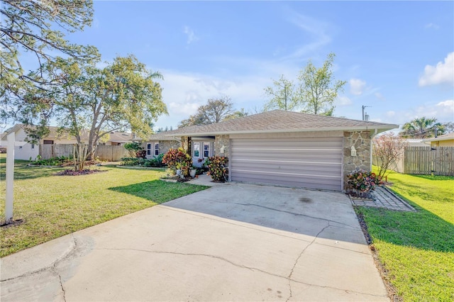 single story home featuring a garage, concrete driveway, stone siding, and a front lawn