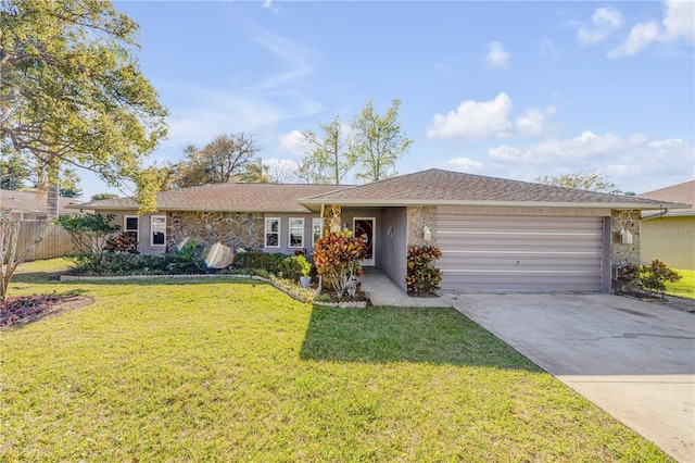 ranch-style house with an attached garage, stone siding, a front lawn, and concrete driveway