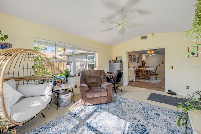 living room with lofted ceiling, visible vents, and a ceiling fan