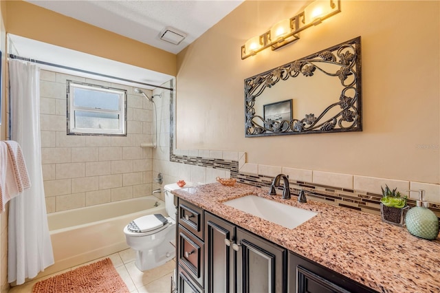 bathroom featuring tile patterned flooring, toilet, visible vents, vanity, and shower / bath combo