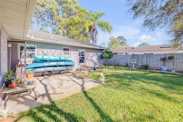 view of yard featuring a patio area and fence