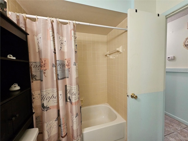 full bathroom with baseboards, shower / tub combo, and tile patterned floors