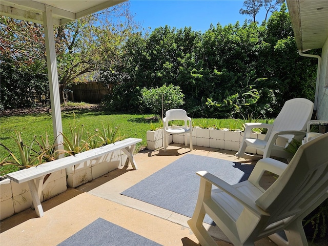 view of patio featuring fence