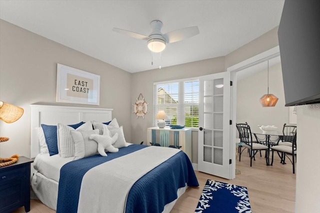 bedroom with light wood finished floors and ceiling fan