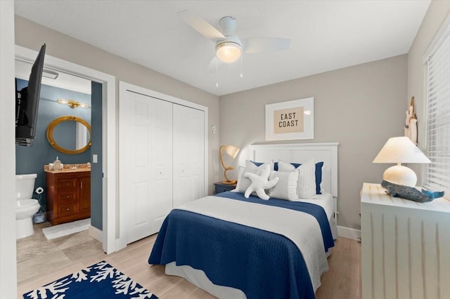 bedroom with a ceiling fan, a closet, baseboards, and light wood finished floors