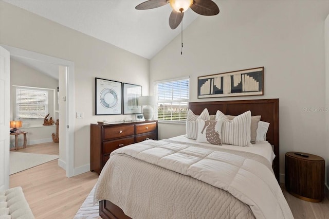 bedroom with ceiling fan, high vaulted ceiling, light wood finished floors, and baseboards