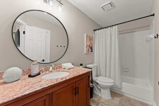 full bathroom featuring shower / bath combo with shower curtain, vanity, and toilet