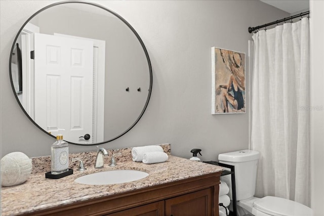 full bath featuring toilet and vanity